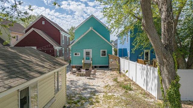 521 Madison Ave, Cape Charles, VA 23310 - view of side of property featuring roof with shingles, fence, and entry steps