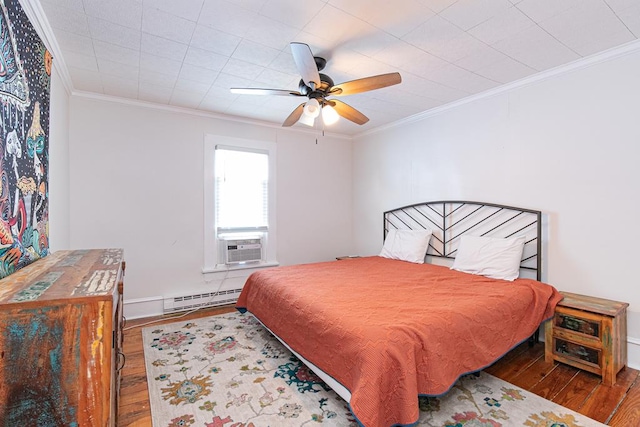 521 Madison Ave, Cape Charles, VA 23310 - bedroom featuring cooling unit, ornamental molding, hardwood / wood-style floors, and baseboard heating