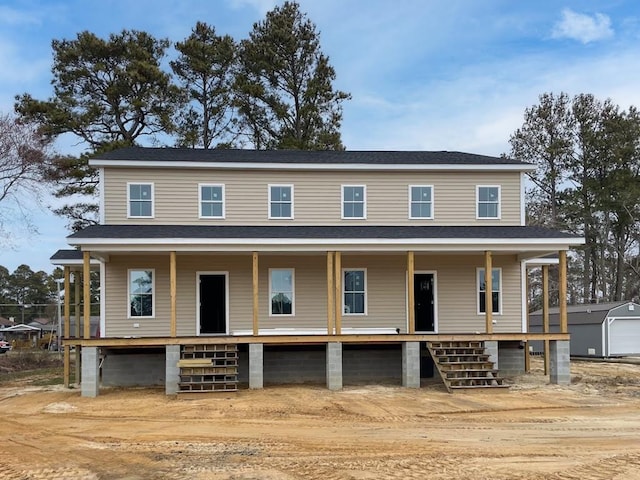 view of front of property featuring an outbuilding and a porch