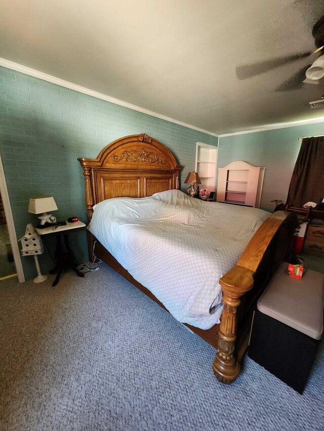 bedroom with ceiling fan, ornamental molding, and brick wall