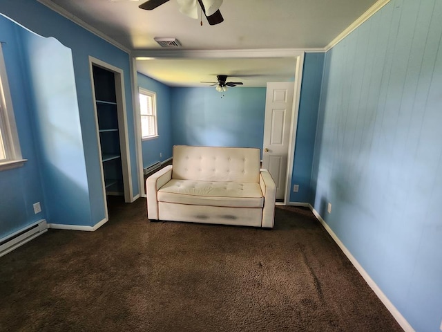 4068 Ridge Rd, Chincoteague, VA 23336 - unfurnished room featuring a ceiling fan, dark carpet, ornamental molding, baseboards, and a baseboard heating unit