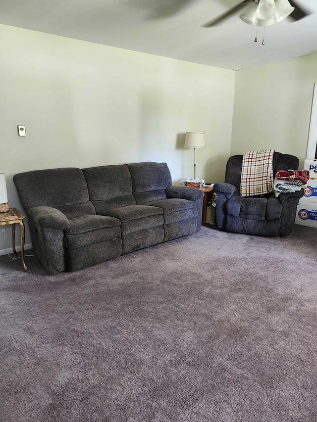 living room with ceiling fan and carpet floors