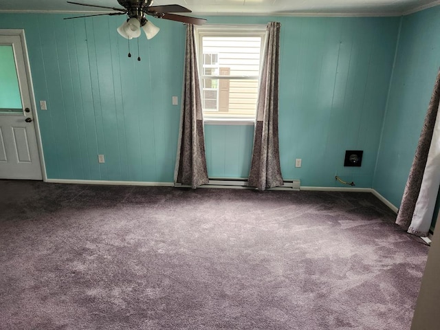 4068 Ridge Rd, Chincoteague, VA 23336 - spare room with carpet flooring, baseboards, a ceiling fan, and wooden walls