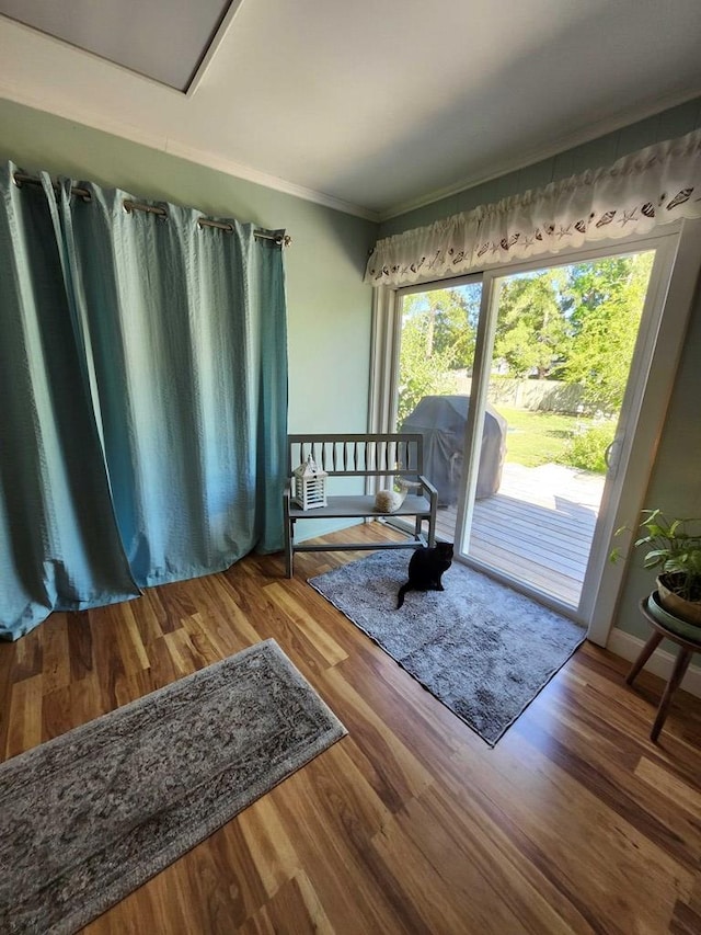 interior space with crown molding and hardwood / wood-style floors