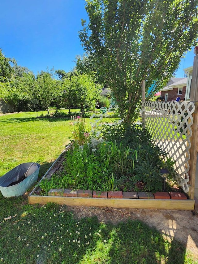 4068 Ridge Rd, Chincoteague, VA 23336 - view of yard featuring a vegetable garden