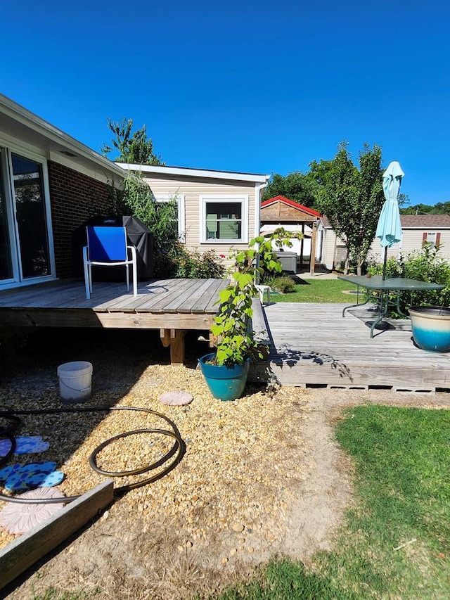 view of yard featuring a gazebo and a deck