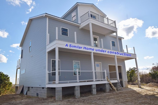 2383-2 Main St, Chincoteague, VA 23336 - view of front of house with a balcony and covered porch