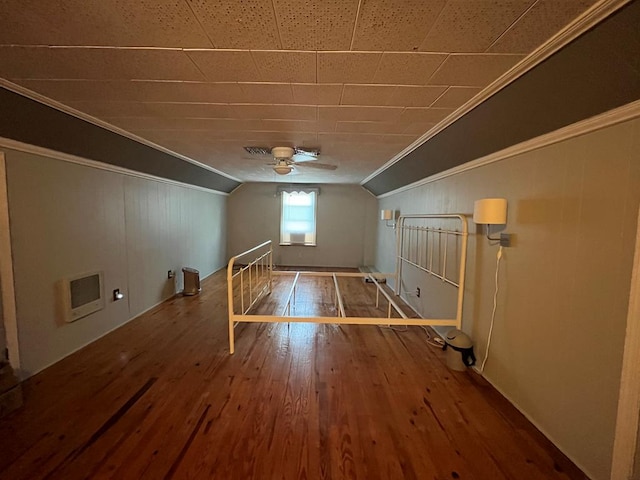 bonus room with hardwood / wood-style floors, heating unit, ceiling fan, and lofted ceiling