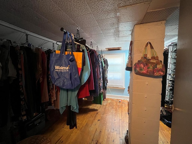 spacious closet featuring hardwood / wood-style flooring