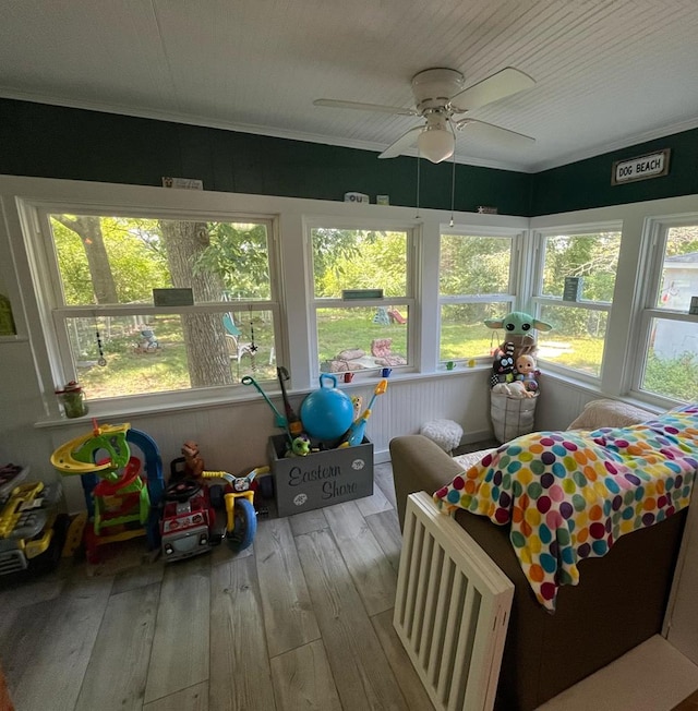 sunroom / solarium with ceiling fan