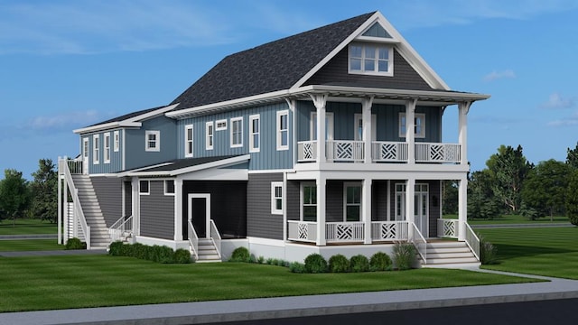 rear view of property with a yard and covered porch