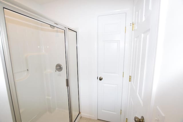 bathroom featuring an enclosed shower