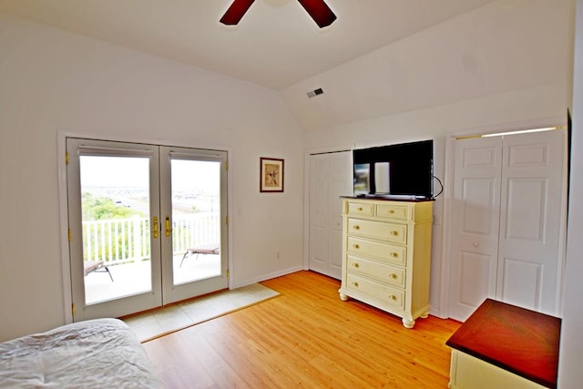 unfurnished bedroom featuring ceiling fan, french doors, vaulted ceiling, access to outside, and light wood-type flooring