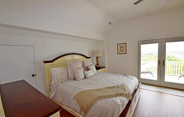 bedroom with french doors, vaulted ceiling, ceiling fan, access to exterior, and light hardwood / wood-style floors