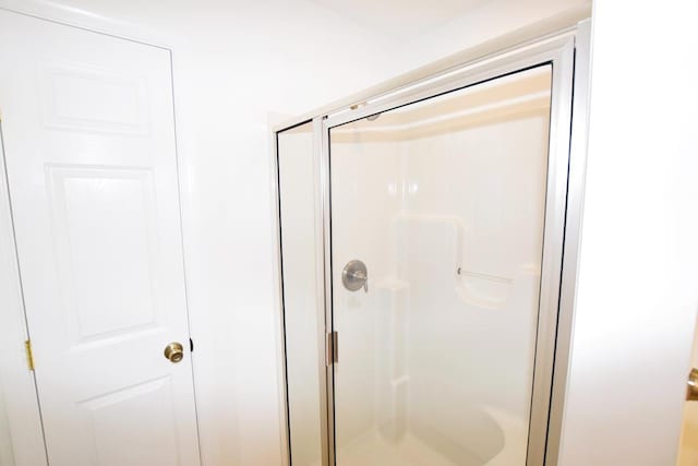 bathroom featuring an enclosed shower