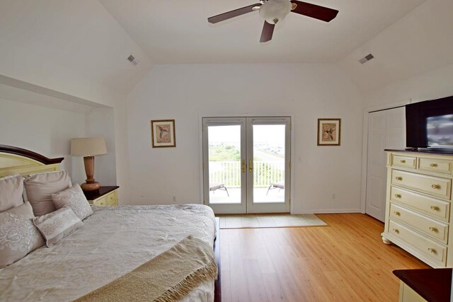 bedroom featuring light wood-type flooring, access to outside, vaulted ceiling, and ceiling fan