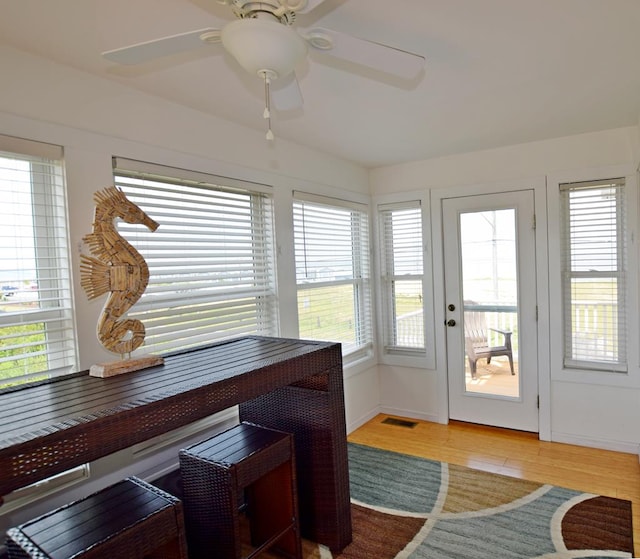 sunroom / solarium with ceiling fan