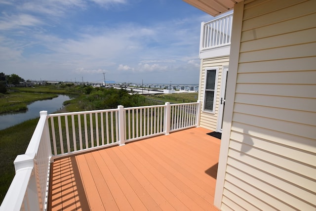 wooden terrace with a water view