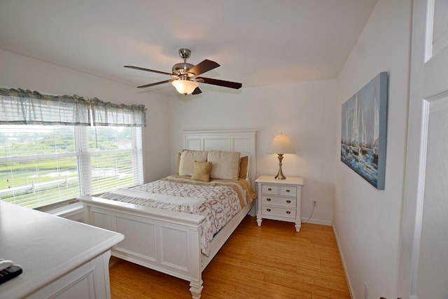 bedroom featuring light hardwood / wood-style flooring and ceiling fan