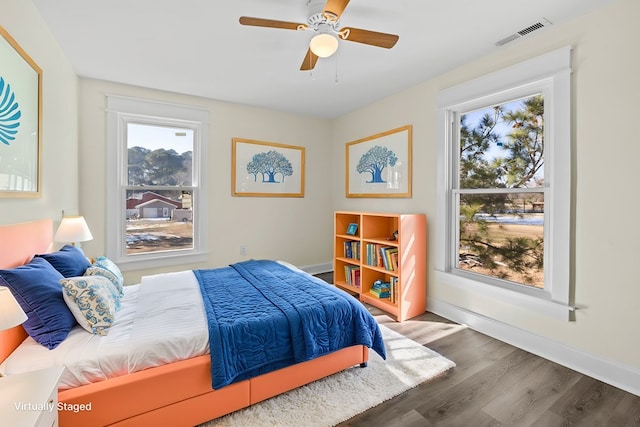 bedroom featuring wood-type flooring and ceiling fan