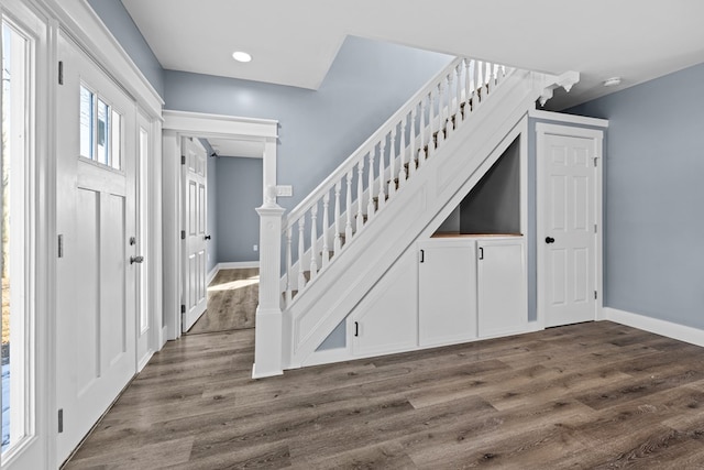 foyer with dark wood-type flooring