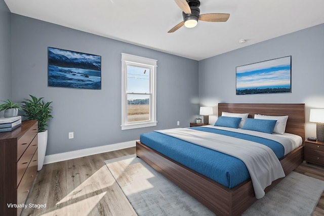 bedroom featuring ceiling fan and light wood-type flooring