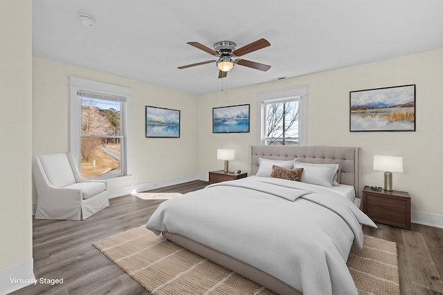 bedroom with hardwood / wood-style flooring and ceiling fan