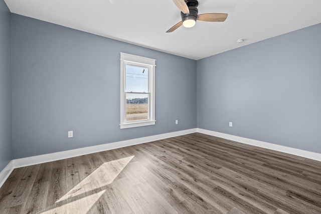 empty room featuring hardwood / wood-style floors and ceiling fan