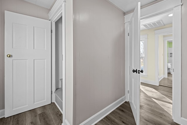 hallway with hardwood / wood-style floors