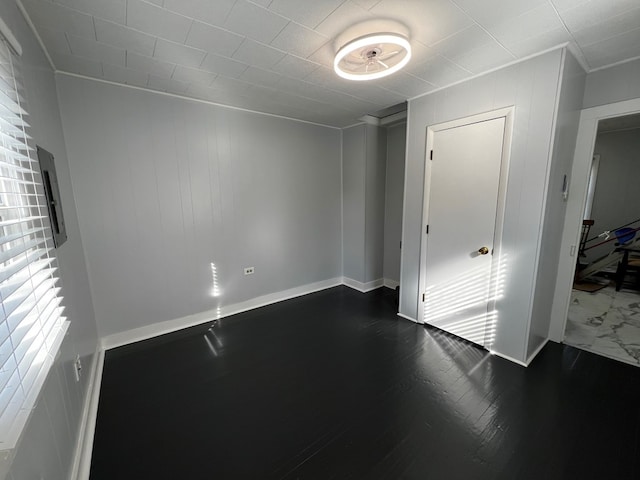 spare room featuring hardwood / wood-style flooring and a wealth of natural light