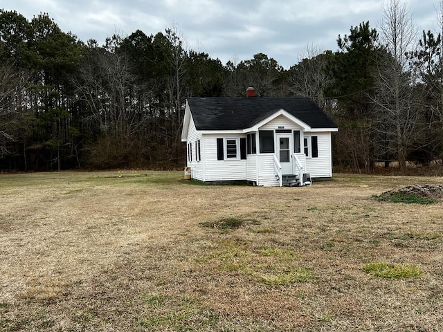 view of outdoor structure with a yard