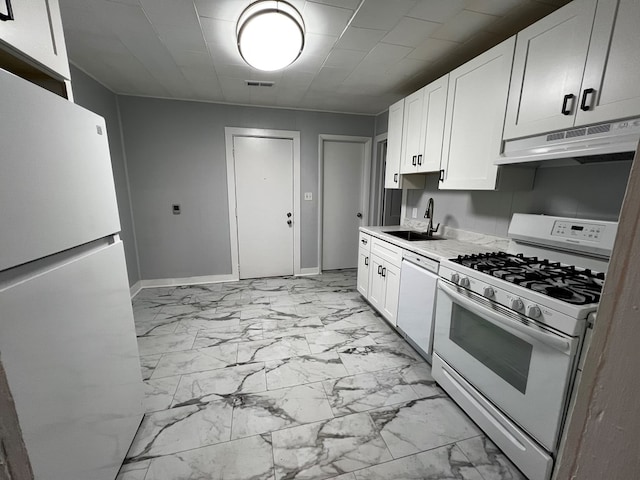 kitchen with white appliances, sink, and white cabinets