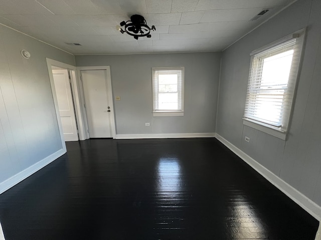 spare room featuring hardwood / wood-style floors