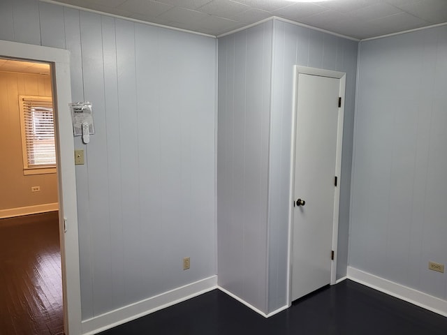 spare room with dark hardwood / wood-style flooring