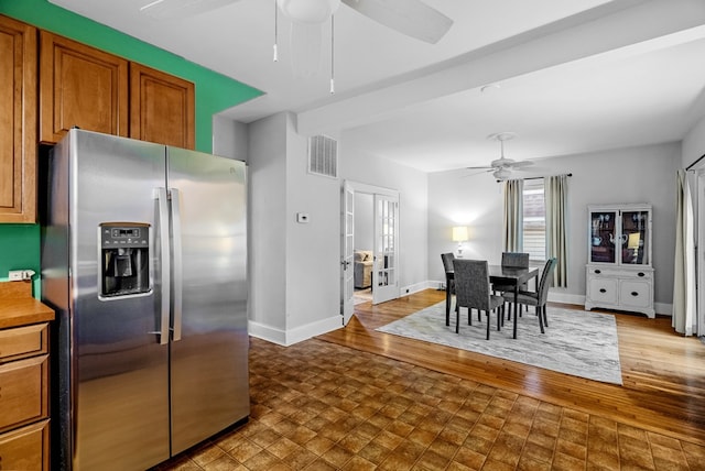 kitchen featuring stainless steel fridge with ice dispenser, french doors, ceiling fan, and wood-type flooring