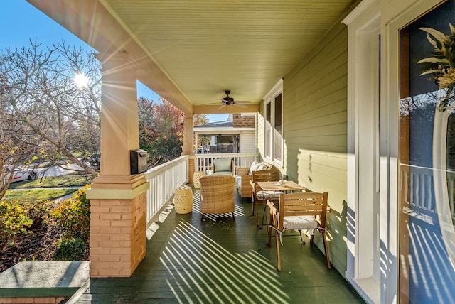 exterior space featuring covered porch and ceiling fan