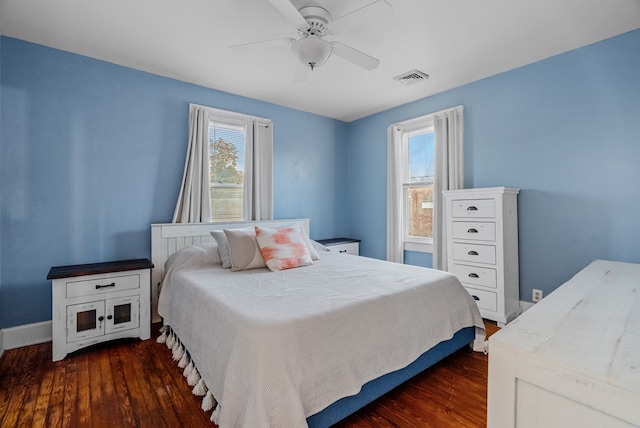 bedroom with ceiling fan and dark wood-type flooring