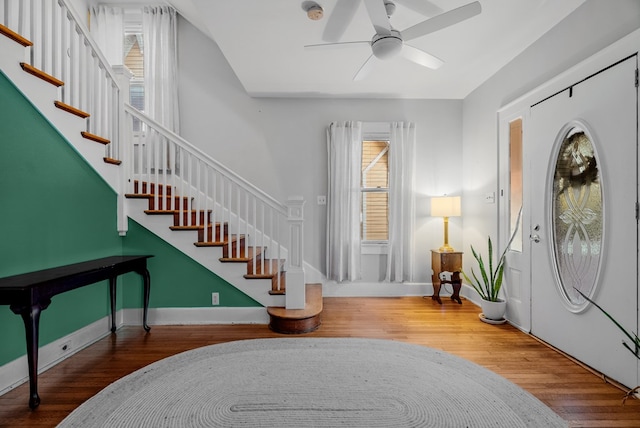 entrance foyer with wood-type flooring and ceiling fan