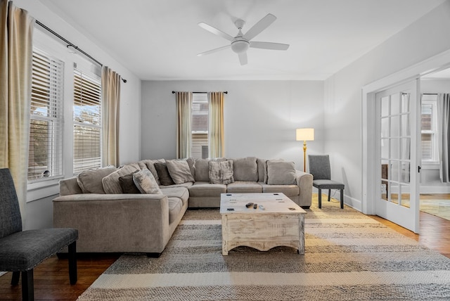 living room with hardwood / wood-style flooring and ceiling fan