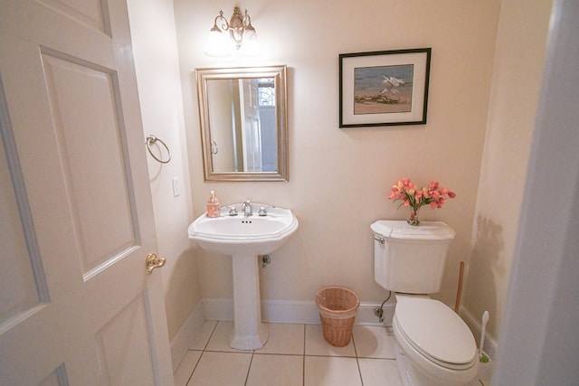 bathroom with tile patterned floors and toilet