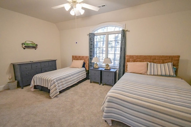 bedroom featuring lofted ceiling, light carpet, and ceiling fan