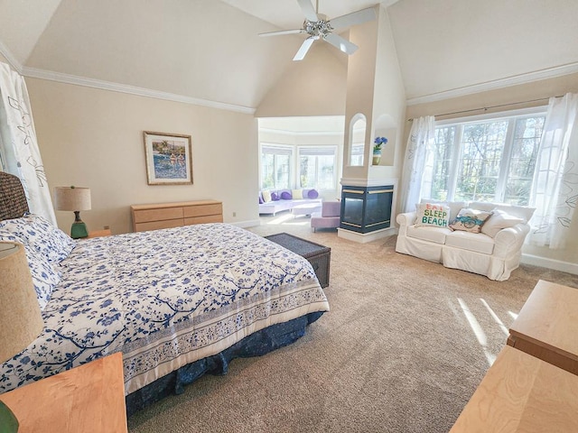 carpeted bedroom with ceiling fan, a multi sided fireplace, ornamental molding, and high vaulted ceiling