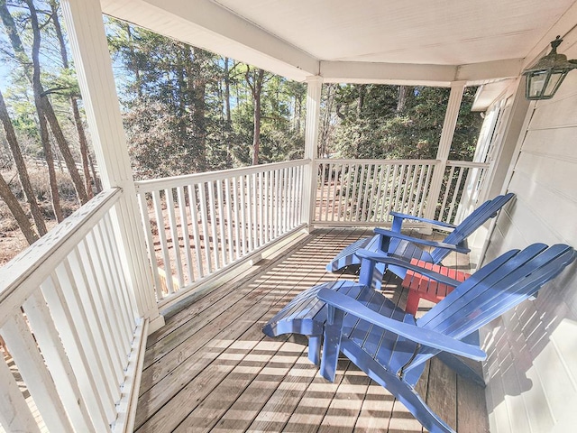 wooden deck featuring covered porch