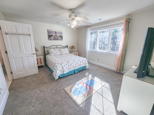 carpeted bedroom featuring ceiling fan