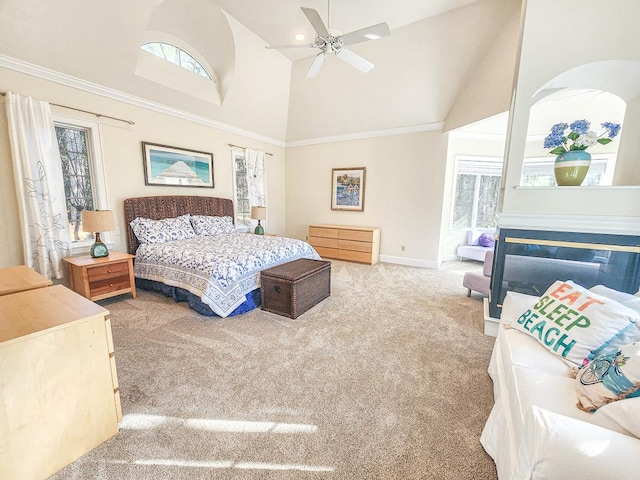 bedroom with ceiling fan, carpet flooring, and high vaulted ceiling