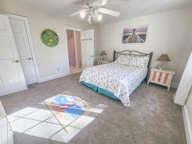 bedroom featuring ceiling fan and carpet