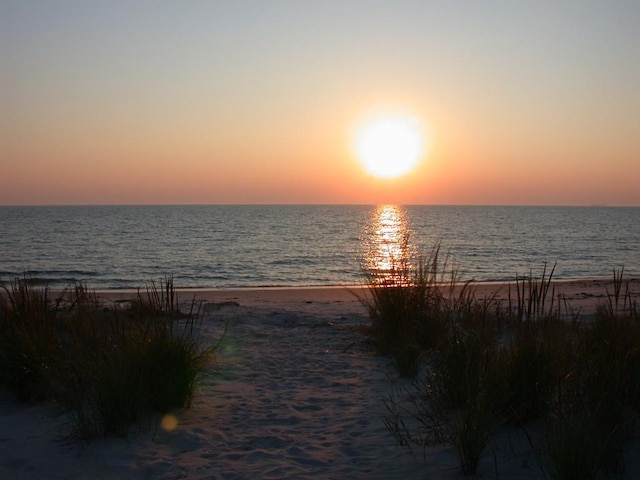 property view of water featuring a beach view