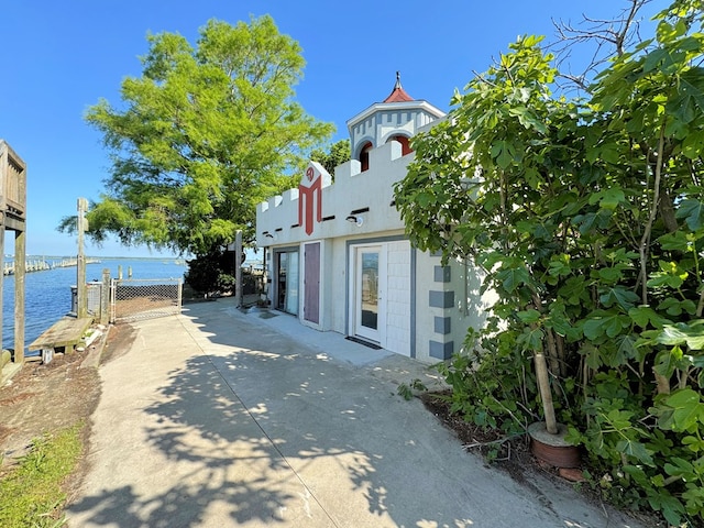 view of property exterior with a water view