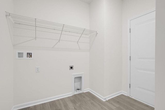 laundry room with hookup for an electric dryer, washer hookup, and light hardwood / wood-style flooring