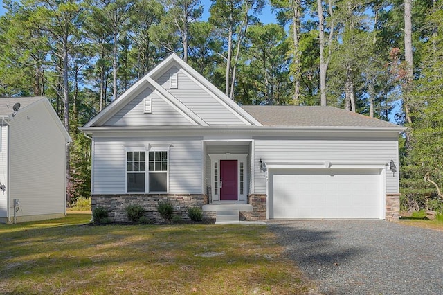 view of front of home with a front lawn and a garage